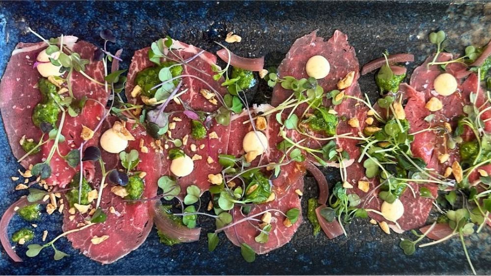 Beef Carpaccio with Terrapin Ridge Farms Jalapeno Aioli Garnishing Squeeze Beef Carpaccio with Terrapin Ridge Farms Jalapeno Aioli Garnishing Squeeze